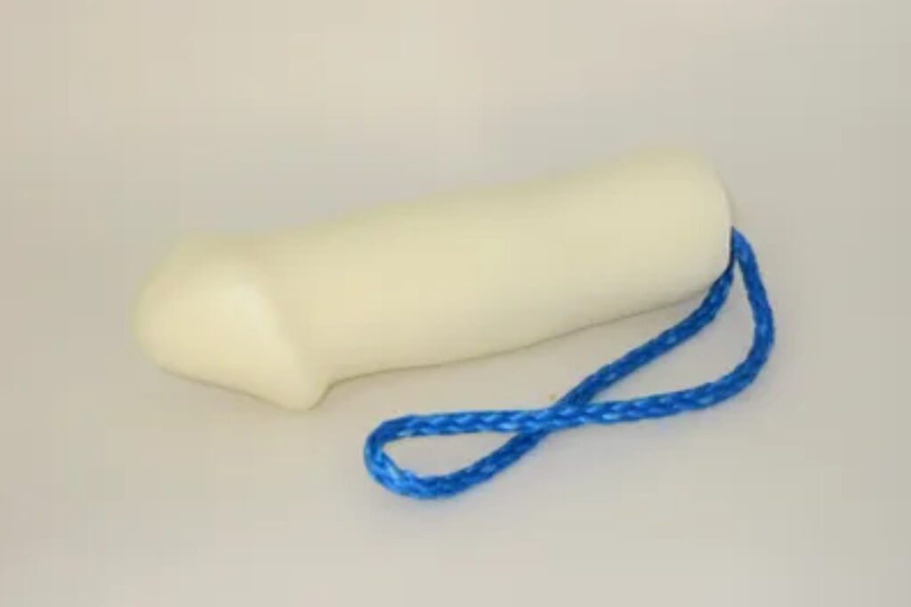 A white condom with blue string around it.
