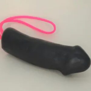 A black dildo with pink string on it.