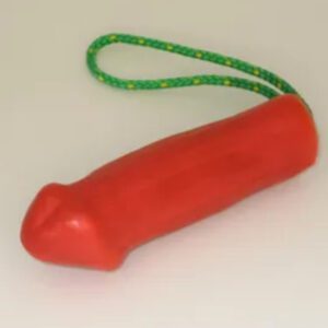 A red toy with green string hanging from it.
