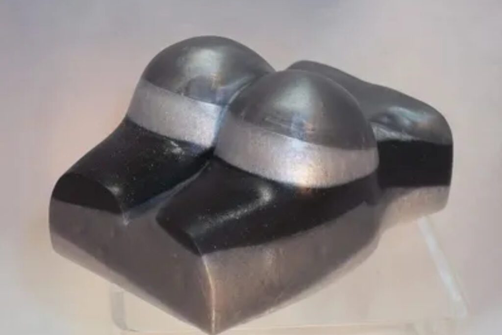 A pair of black and silver objects sitting on top of each other.