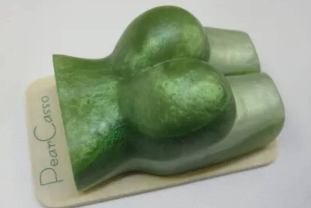 A green piece of paper with two pieces of food on it.
