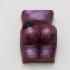 A purple sculpture of a woman 's buttocks.