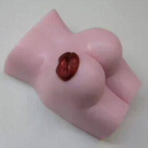 A pink toy shaped like a woman 's breast.