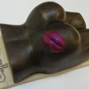 A chocolate hand with a pink lip mark