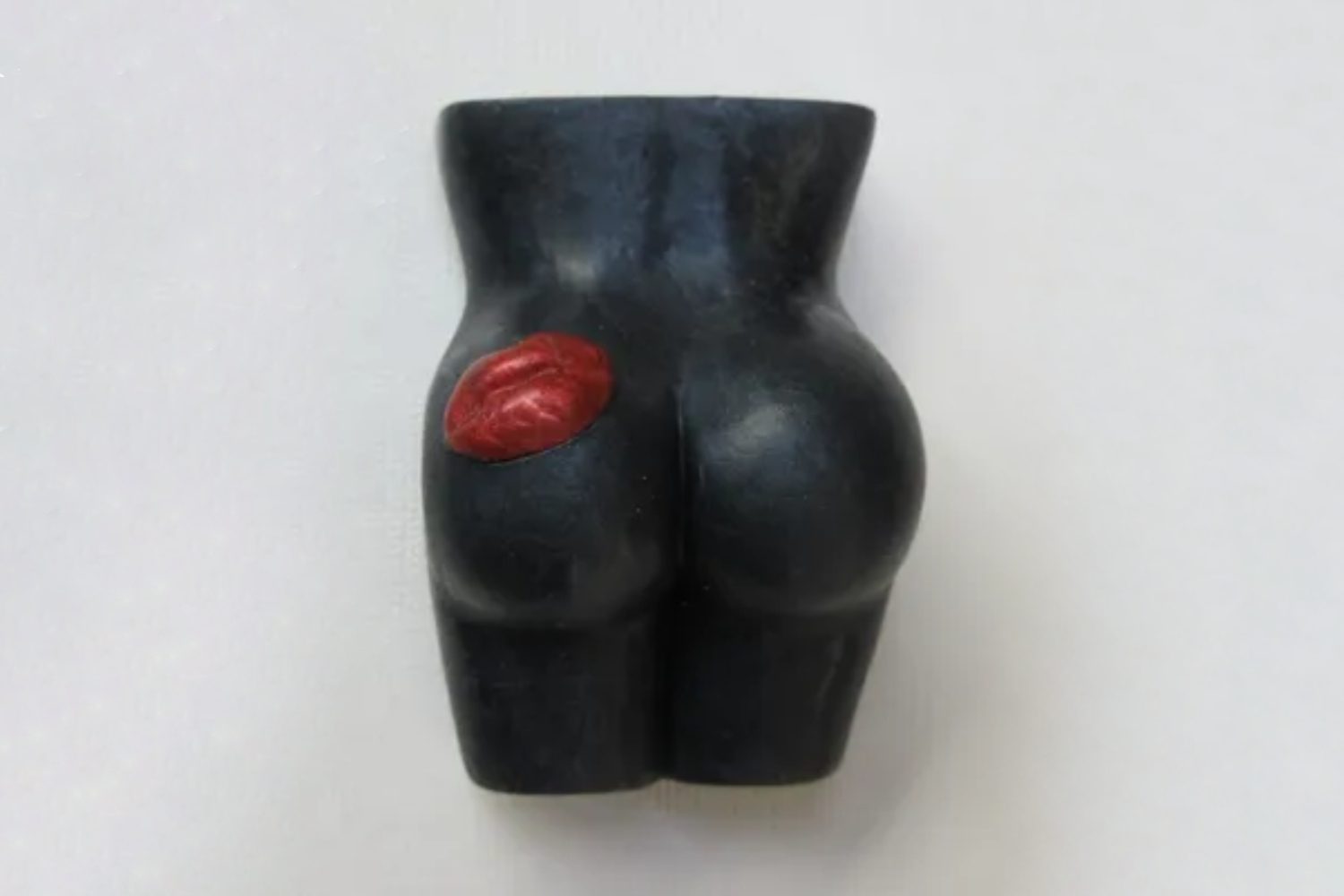 A black butt with red lips on it.
