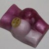 A close up of a candle with the candles burning