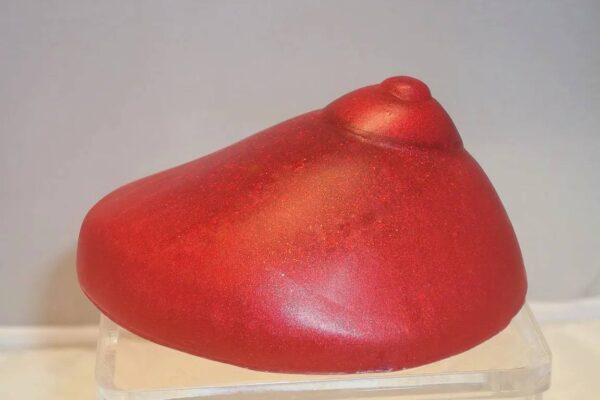 A red object sitting on top of a table.