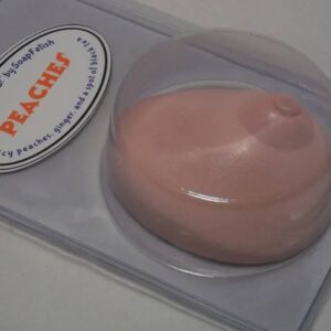 A pink soap sitting on top of a plastic container.