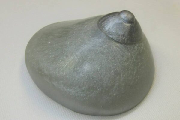 A stone like object sitting on top of a table.