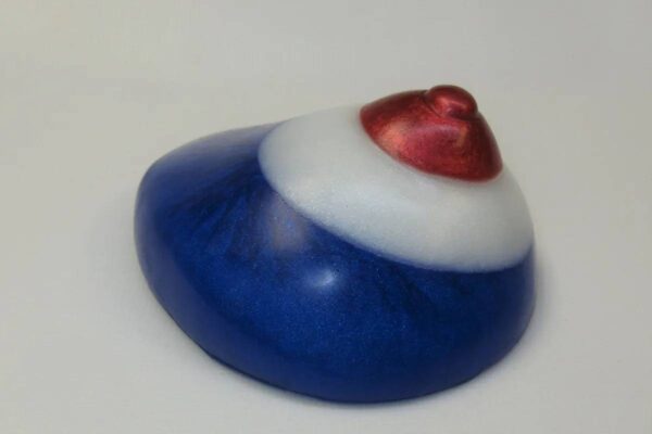 A blue and white object with red heart on top.
