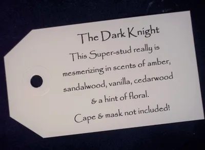 A white tag with the words " the dark knight ".