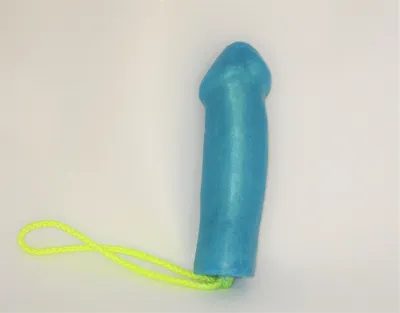 A blue condom with a string attached to it.