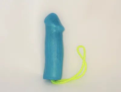 A blue toy with a yellow string attached to it.