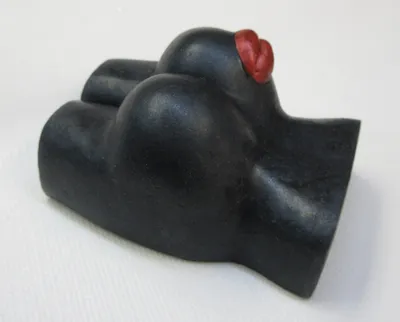 A black rubber glove with red nose on it.