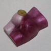 A purple and white object with a button on it.