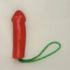 A red condom with green string on it.
