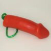 A red toy with green string attached to it.