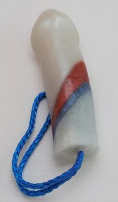 A white tube with red, blue and orange stripes on it.