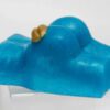 A blue soap with a gold leaf on it.