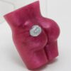 A pink butt toy with a button on it.