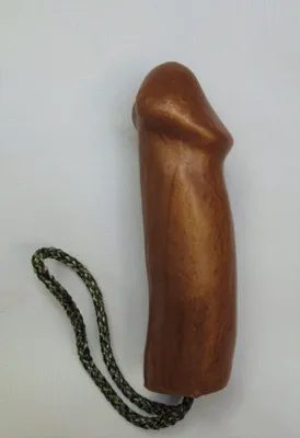 A wooden toy with a rope attached to it.