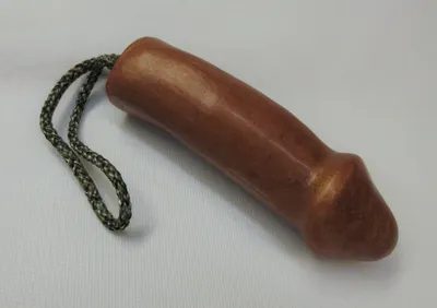 A wooden toy with a string attached to it.