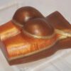 A piece of cake with two balls on top.
