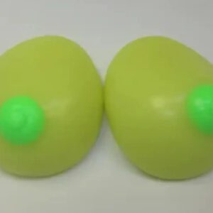 Two green eggs with a green ball on top of them.