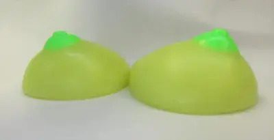 Two green apples sitting on top of a table.