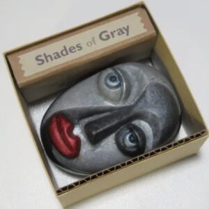 A box with a face in it and the words shades of gray