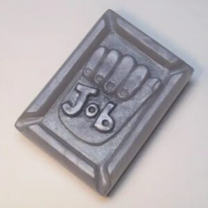 A metal object with the word " job " on it.