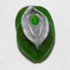 A green leaf with a silver leaf on it.