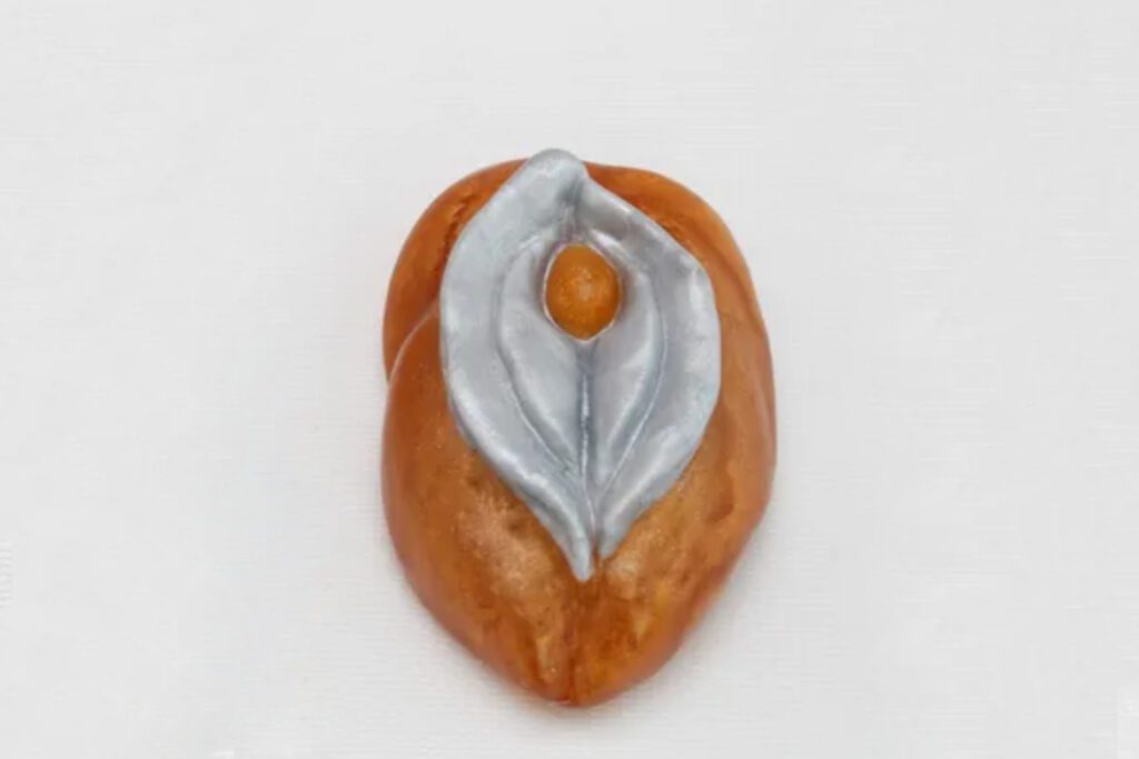 A close up of an orange and silver object