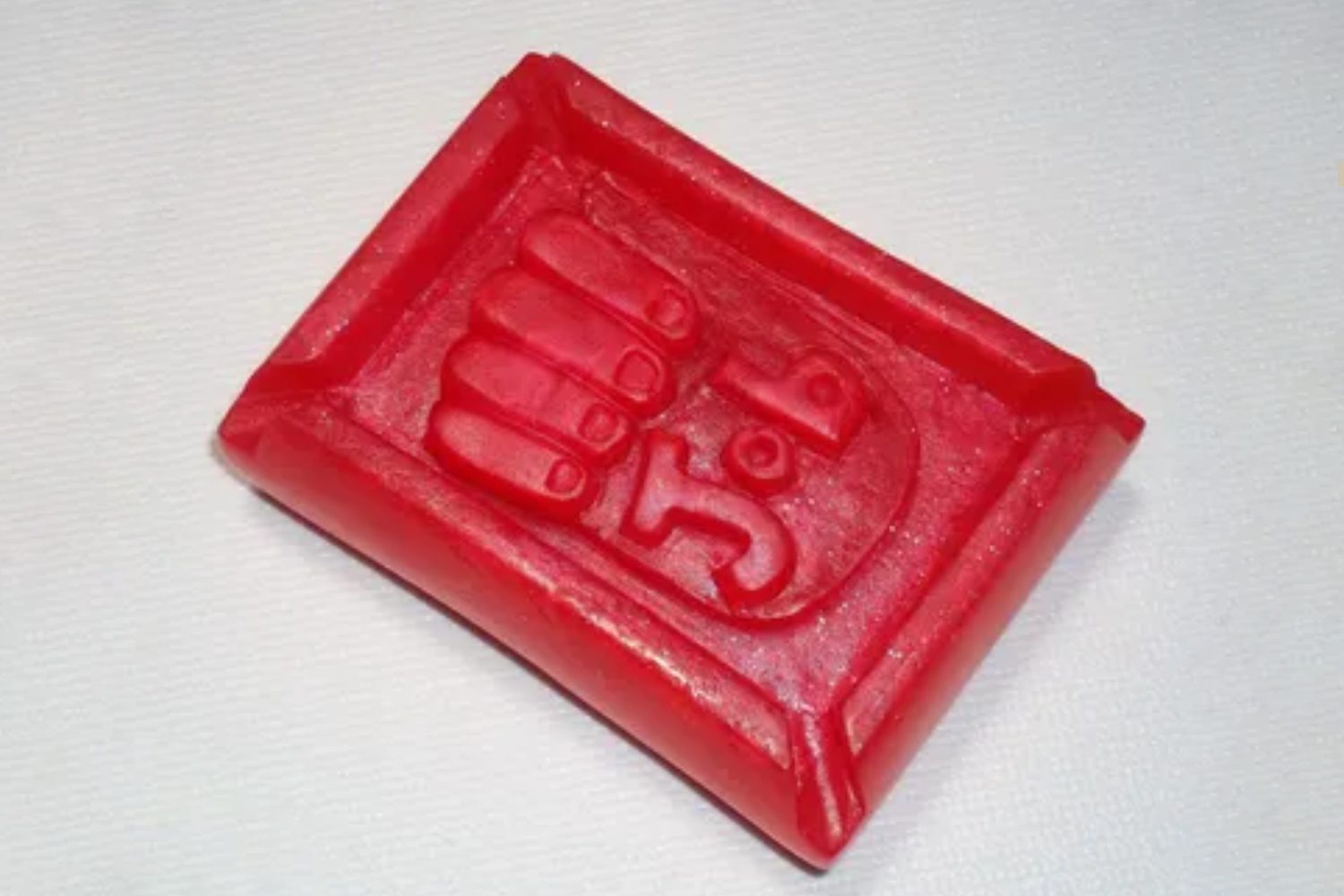 A red soap with the number 5 on it.
