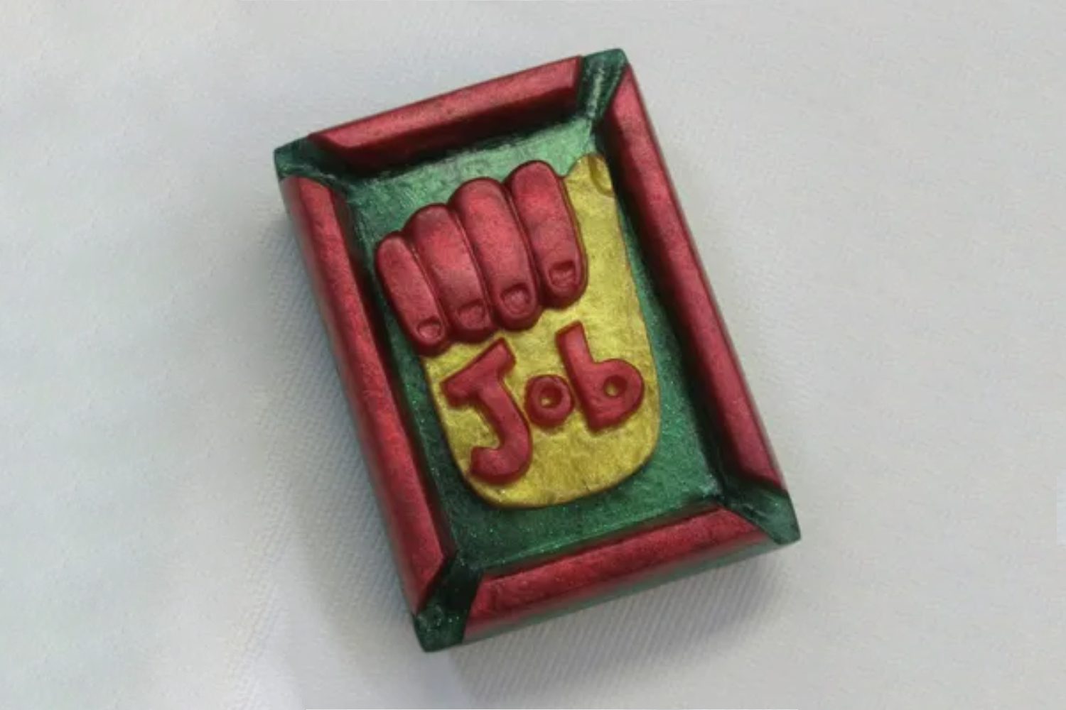 A rectangular object with the word " job " written on it.