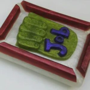 A tray with a green hand on it