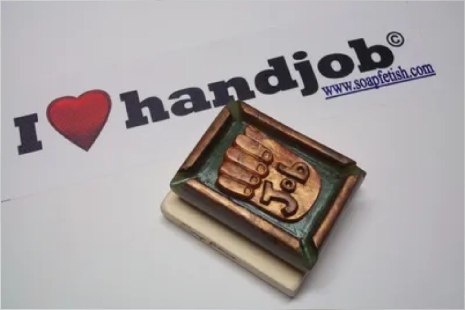 A rubber stamp with the image of a hand on it.