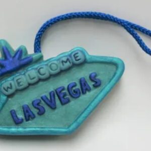 A blue sign with the words " welcome las vegas ".