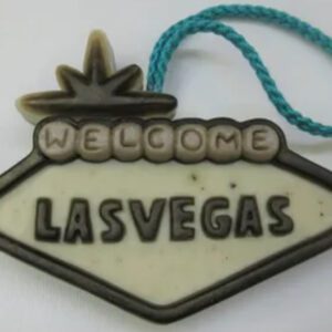 A las vegas sign ornament with the word welcome on it.