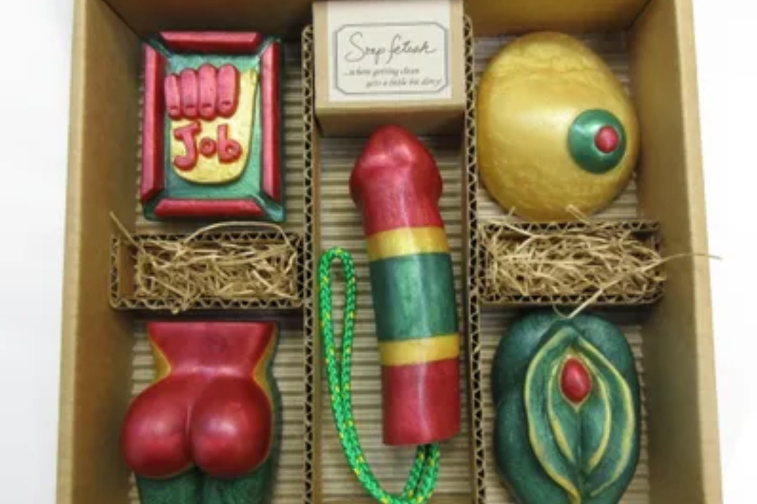 A box of various toys in the shape of a woman 's butt.