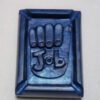 A blue rectangular plaque with the word " job " in it.