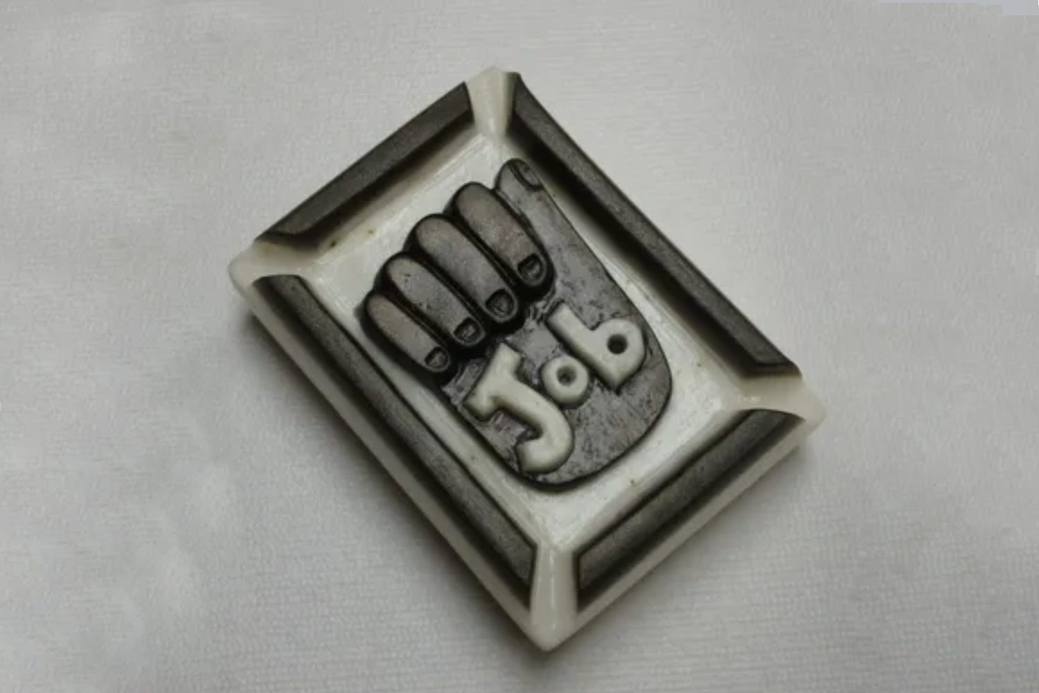 A rubber stamp with the word job written in it.