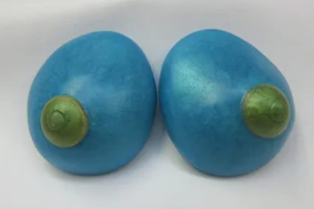 A pair of blue eggs with green tops.