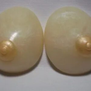 A pair of white buttons with pearls on them.