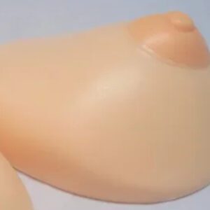 A close up of the tip of a doll 's foot.