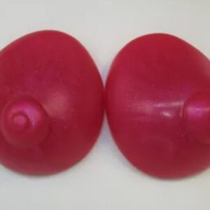 A pair of red buttons on top of a table.
