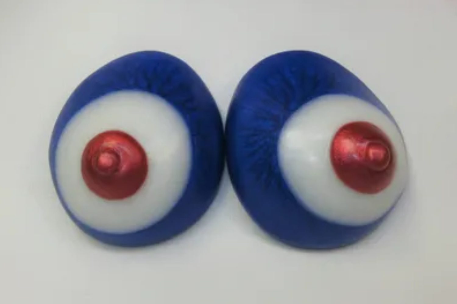 A pair of blue and white eyes with red accents.