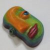 A colorful face shaped candy on top of a table.