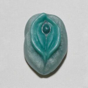 A green leaf shaped bead with a blue center.