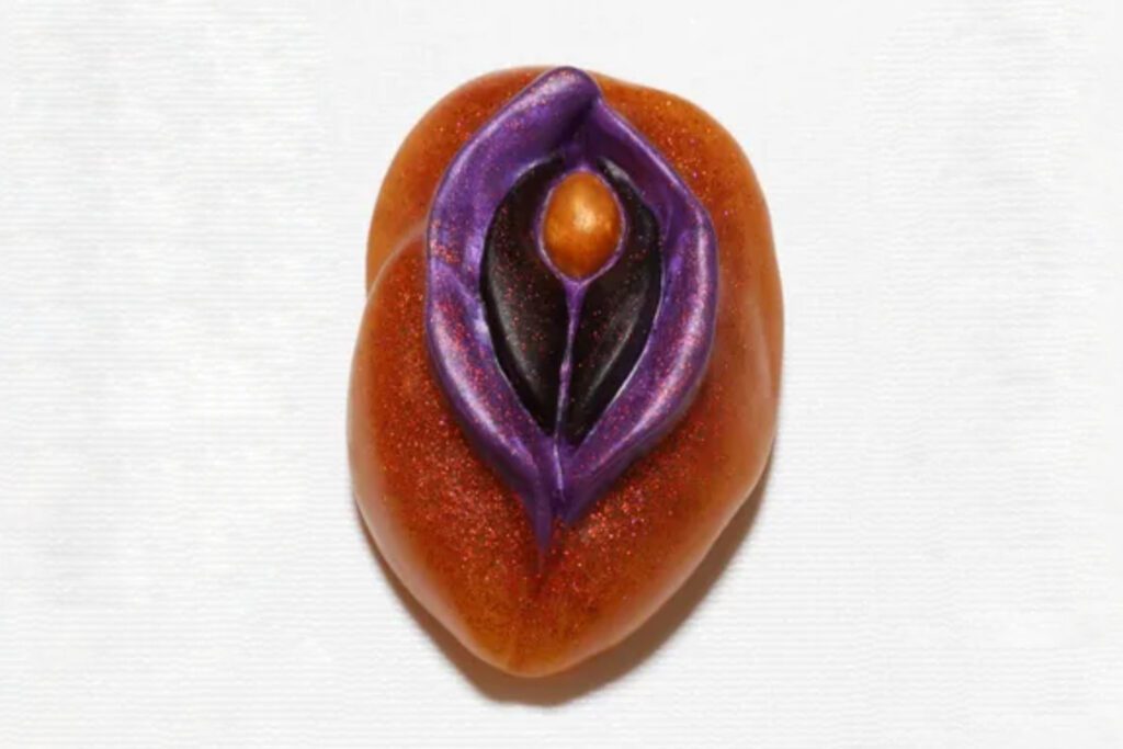A close up of an orange and purple object